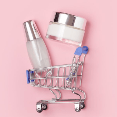 A cart with empty skincare bottles: Guide to Skincare E-commerce Marketing for Beauty Startups