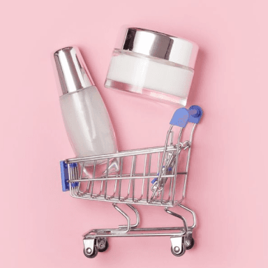 A cart with empty skincare bottles: Guide to Skincare E-commerce Marketing for Beauty Startups